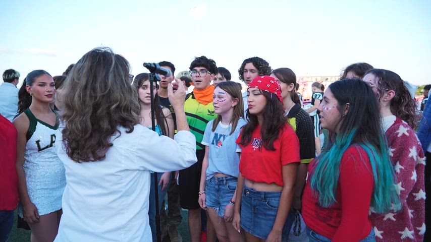 Canyon Lake High School football home game against Navarro High School. The reel includes clips of the game, JROTC students, choir, band, dance, and student section. The cheerleaders cheer with elementary aged girls for their cheer clinic game. There is a high energy. The video ends with a message that says, “In memory of Steve Stanford,” a Comal ISD employee and father of three.