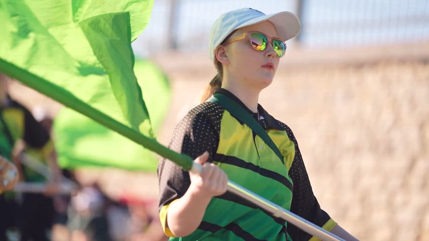Comal county 2025 fair day reel featuring student organizations from Canyon, Canyon Lake, Davenport, and Smithson Valley feeder pattern schools. Community members lined up the sides of the street to watch students marching, dancing, playing instruments, and waving in high spirits.