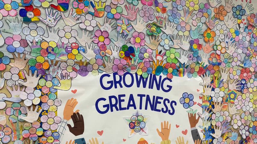 Pictures of the front of a school, and art projects on the hallway walls