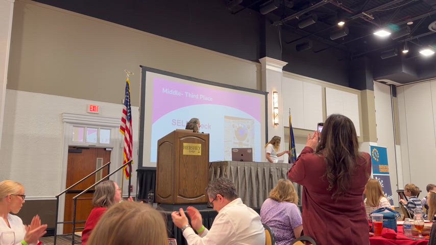 student accepts award