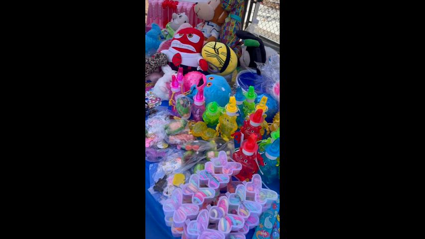Students participating in arts and arts and crafts, cotton candy and nachos, giant pong, Connect 4, and musical chairs.