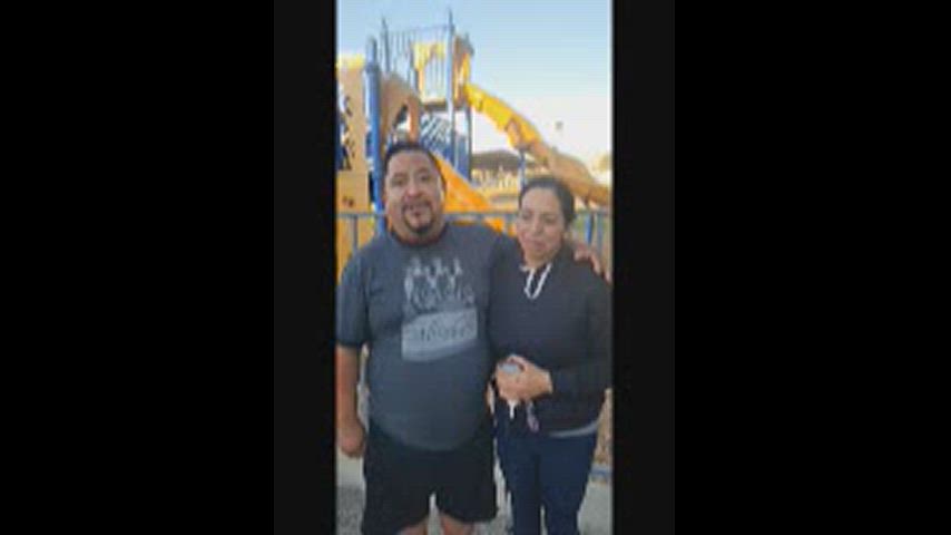 Father and Mother standing side by side.