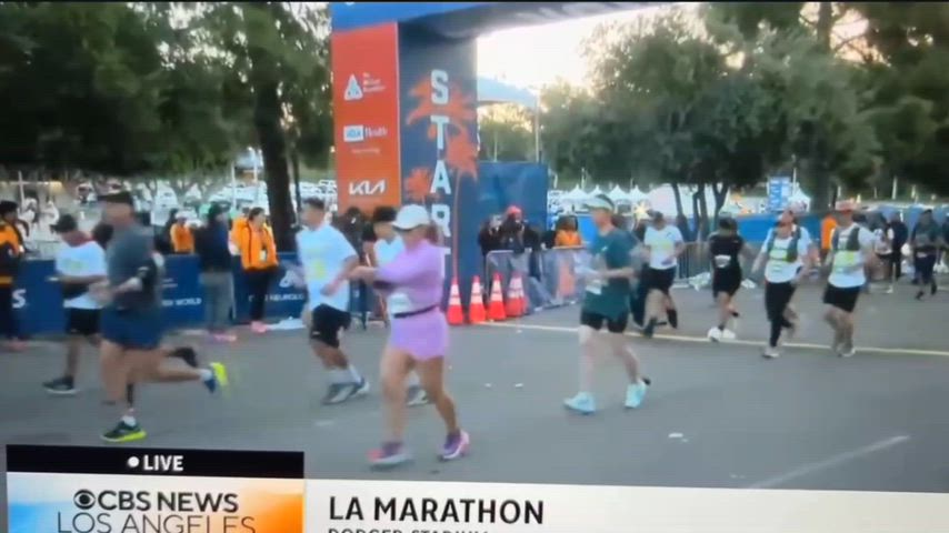 Canoga Park High School students run in background of news story