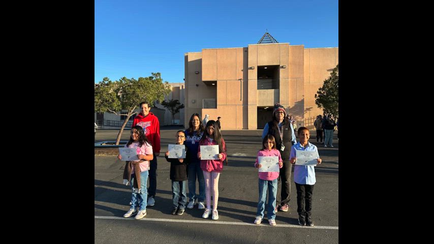 Student holding Certificates