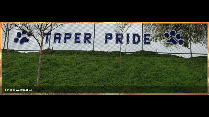 School video of Front entrance, library, and quad. Fence with Tiger mascot and Taper Pride on the fence