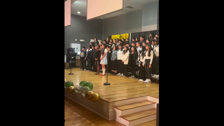 Students signing the wizard of OZ in a chior