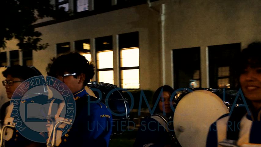 Student perform outside the board room as parents and community cheer them on