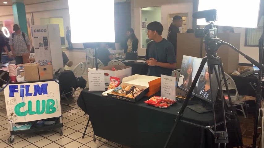 students operate and interview others during event