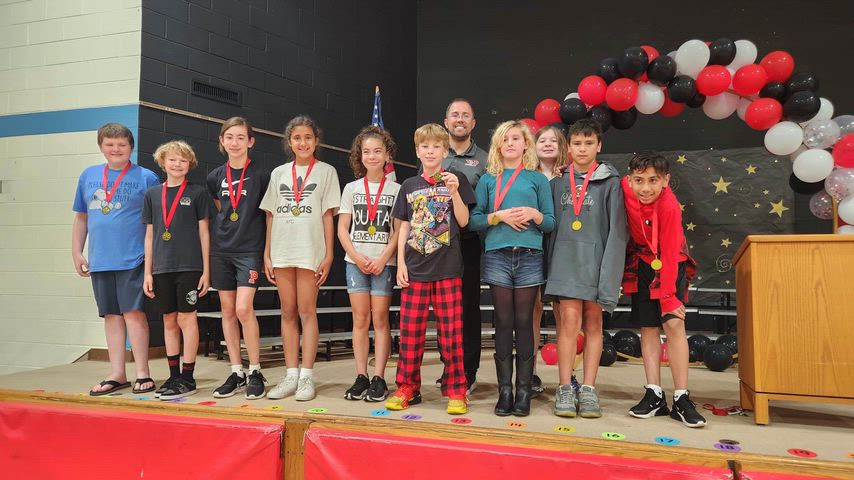 Students and staff photos doing different school activities. 