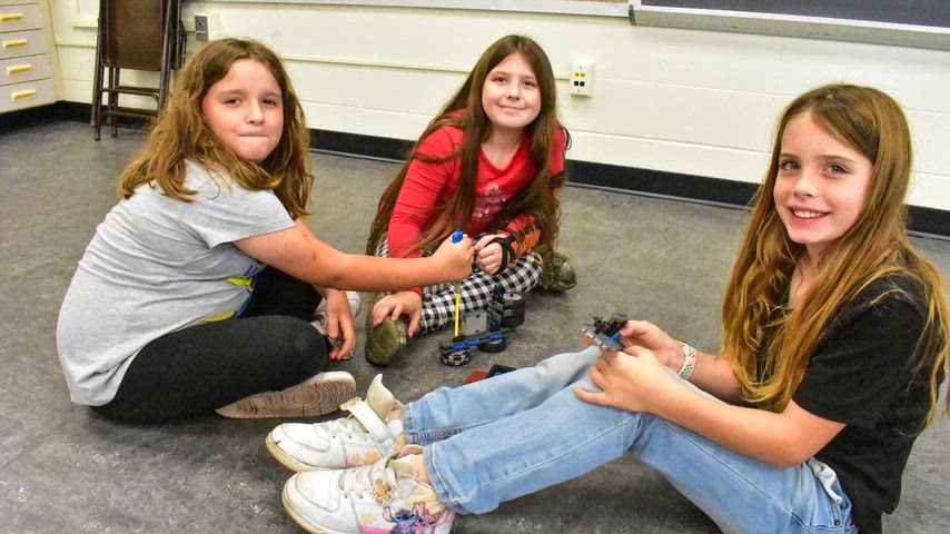 Students and staff photos doing different school activities. 