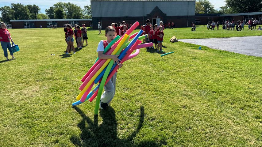 Students and staff photos doing different school activities. 