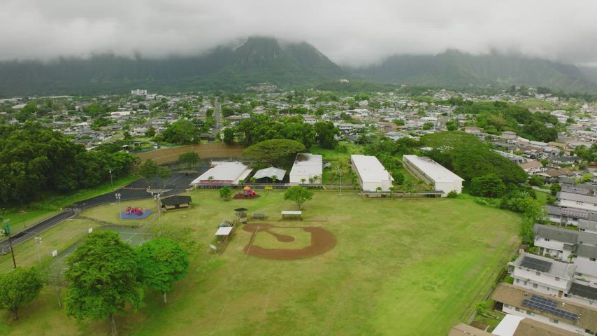 Puohala Village neighborhood in Kaneohe, Hawaii, featuring a mix of historic plantation homes and modern residences.