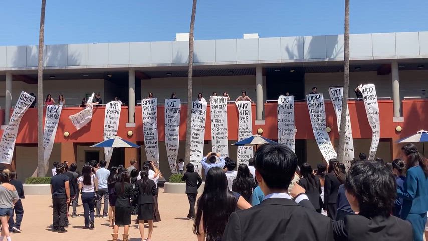 Novice/JV competitors watch the Banners Drop listing finalists for each event