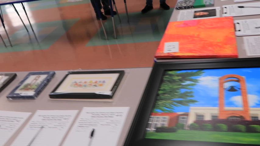 Guests dine blindfolded during the Lights Out Dining & Silent Auction, guided by Tennessee School for the Blind students in a low-light setting.