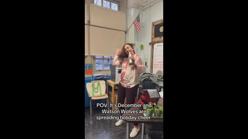 Staff members show off their dance moves to spread holiday happiness.